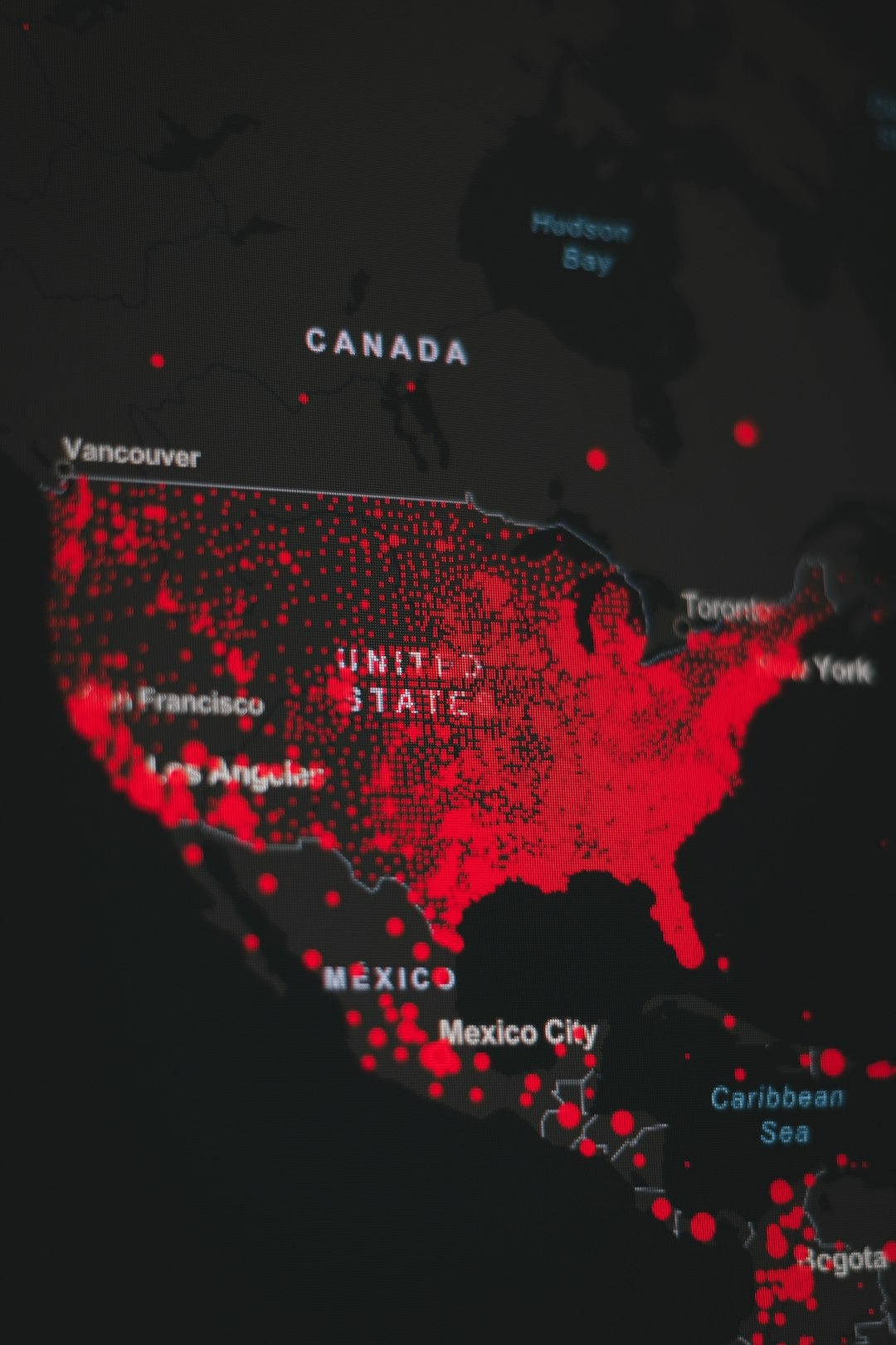 Digital map showing business distribution across North America with red markers.